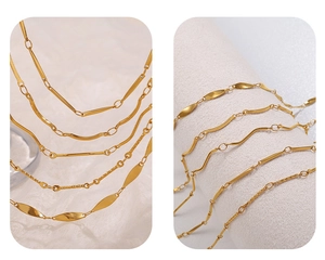 Detail view of 18K gold plated stainless steel chain styles including cable and wave designs