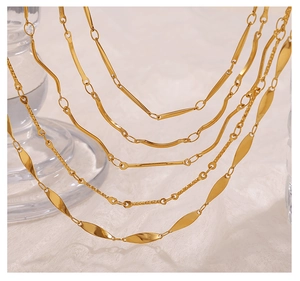 Macro detail of various 18K gold plated stainless steel chain link designs for jewelry