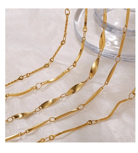 Macro detail of four 18K gold plated chain designs including twist and link styles