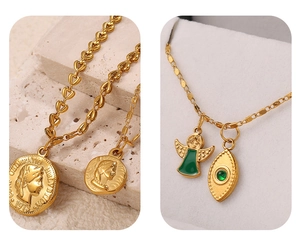 Detail of 18K gold-plated heart link chain with coin and green enamel angel charms