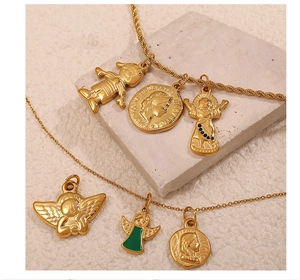 Detail of 18K gold plated charms featuring religious coins and green enamel icons
