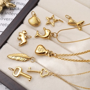 Golden stainless steel ocean theme pendants featuring starfish and seahorse charms
