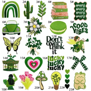 Detail view of 23 forest style floral embroidery patches in vibrant yellow-green tones