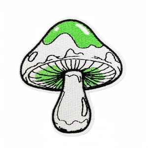 Detailed white and green mushroom embroidered patch with black outlines for clothing and bags