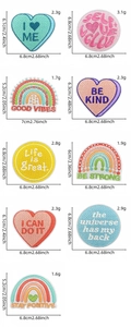 Detail of colorful rainbow heart patches showing precise dimensions and weights