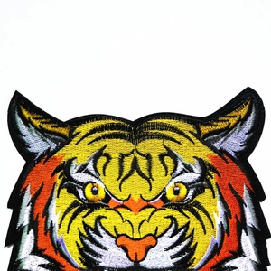 Vibrant tiger head embroidery patch with high-density stitching for DIY apparel decoration