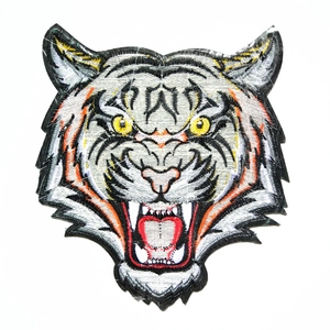 Detailed tiger head embroidery patch with orange and black thread for jackets and DIY clothing