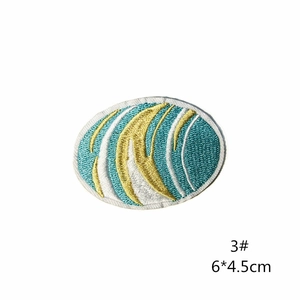 Detailed view of abstract blue and yellow wave embroidery patch with white border 6x4.5cm