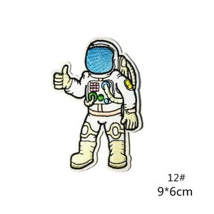 Detail view of astronaut embroidery patch showing fine stitching and 9x6cm size markings