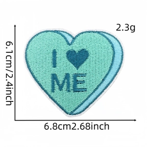 Detail of blue heart embroidered patch with I Love Me text and size measurements