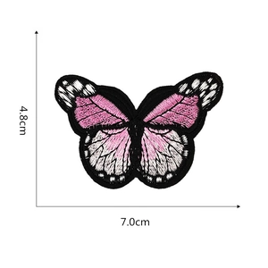 Detail view of pink butterfly embroidery patch with dimensions 4.8cm by 7.0cm