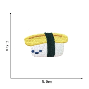 Detail view of cartoon tamago sushi embroidery patch with dimensions 5.0cm x 2.8cm