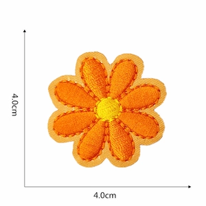 Detailed embroidery of sunflower patch showing 4.0cm dimensions and orange petals