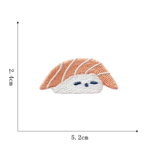 Close-up of salmon sushi embroidered patch with cute cartoon eyes and size details