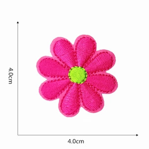 Detail view of pink flower embroidery patch with 4.0cm dimensions and floral stitching
