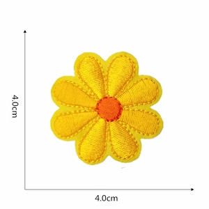 Close-up detail of yellow daisy embroidered patch with dimensions 4.0cm x 4.0cm