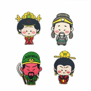Detailed view of four colorful ancient Chinese character embroidery patches for clothing decoration