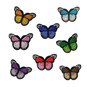 Set of 8 colorful butterfly embroidered patches with detailed wing textures and black borders