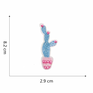 Blue cactus embroidery patch in pink pot with dimensions 8.2cm x 2.9cm on white background