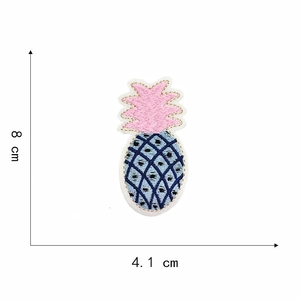 Detailed blue and pink embroidered pineapple patch showing dimensions of 8cm by 4.1cm