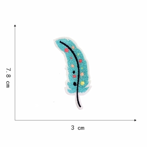 Detail view of blue embroidered feather patch with colorful polka dots and 7.8cm size mark
