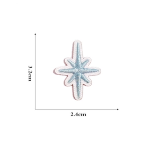 Detailed macro view of a 3.2cm blue and white star embroidered patch with size indicators