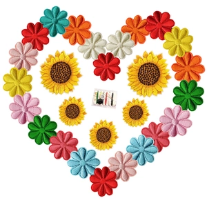 Colorful daisy and sunflower embroidery patches set with a mini sewing kit on white background