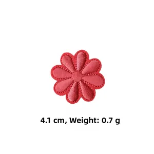 Close-up of a red daisy embroidered patch with high precision stitching and 4.1cm size