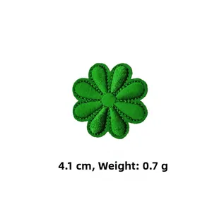 Detailed macro shot of a green flower embroidery patch with 4.1cm diameter and 0.7g weight