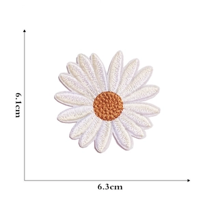 Detail view showing white daisy flower embroidery patch dimensions 6.1cm by 6.3cm