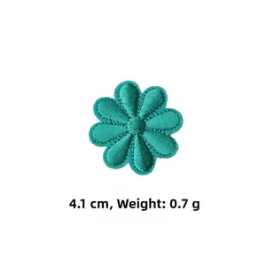 Detail showing a 4.1cm green embroidered daisy flower patch with 0.7g weight