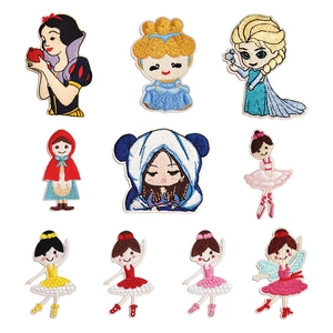 Detailed close-up of embroidered princess patches showing intricate needlework and vibrant colors