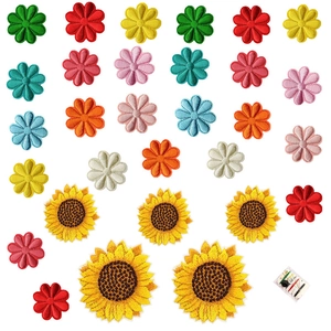 Colorful sunflower and daisy embroidery patches set with a mini sewing kit on white background