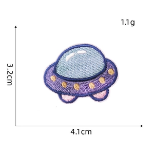 Detail view of a 4.1x3.2cm purple embroidered UFO patch with golden dot accents
