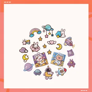 Detail of assorted cartoon space embroidery patches including astronauts and planets