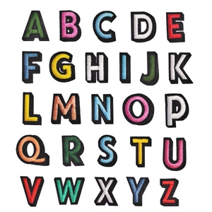 Detailed macro view showing a full set of 26 colorful A-Z alphabet embroidered patches