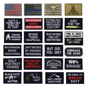 Macro view of tactical embroidered patches with velcro backing and diverse military motifs