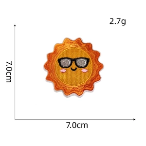 Detailed view of sun embroidery patch with sunglasses measuring 7.0cm and weighing 2.7g