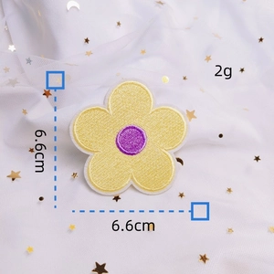 Detailed close-up of macaron yellow flower embroidery patch with 6.6cm size marker