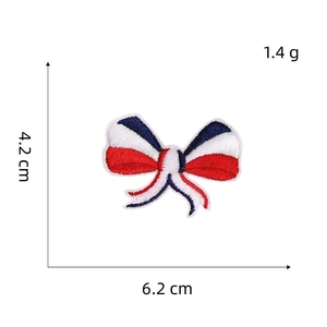 Detailed macro shot of a red white and blue bow embroidery patch with 6.2cm size measurement