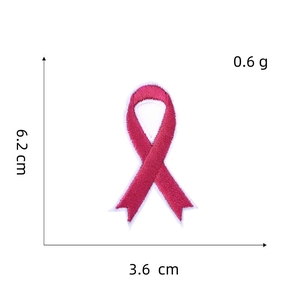 Detailed embroidery patch showing dimensions of pink awareness ribbon at 6.2 x 3.6 cm