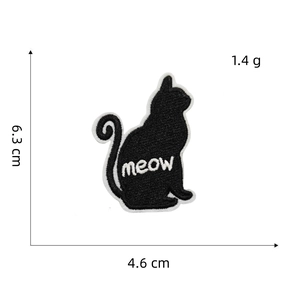 Detail view of cat-shaped embroidered patch with meow text and dimension markings