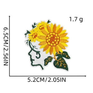 Detailed embroidery of sunflower vine forming a woman profile silhouette
