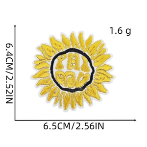 Detailed embroidery view of yellow sunflower patch with Phi Mu lettering on white background