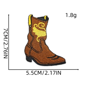 Detailed size view of cowboy boot embroidered patch with brown texture and yellow scrolls