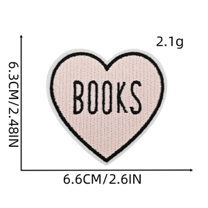 Detail showing pink heart-shaped BOOKS embroidered patch with dimensions 6.6cm x 6.3cm