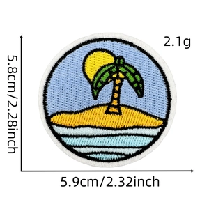 Close-up of tropical island embroidery patch with palm tree and sun for clothing