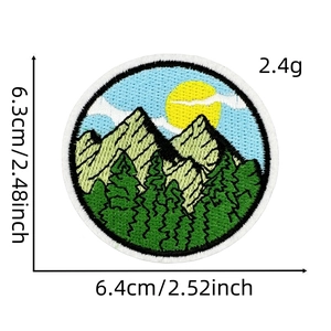 Detail view of round nature embroidery patch showing mountain and forest with dimensions