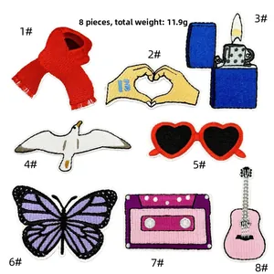 Set of 8 vintage embroidered patches featuring guitar, cassette, and peace symbols
