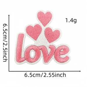 Detail showing pink embroidered love heart patch with 6.5cm dimensions and fine needlework